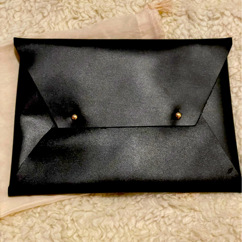 Black leather ethically-sourced clutch pouch handmade by artisans in India